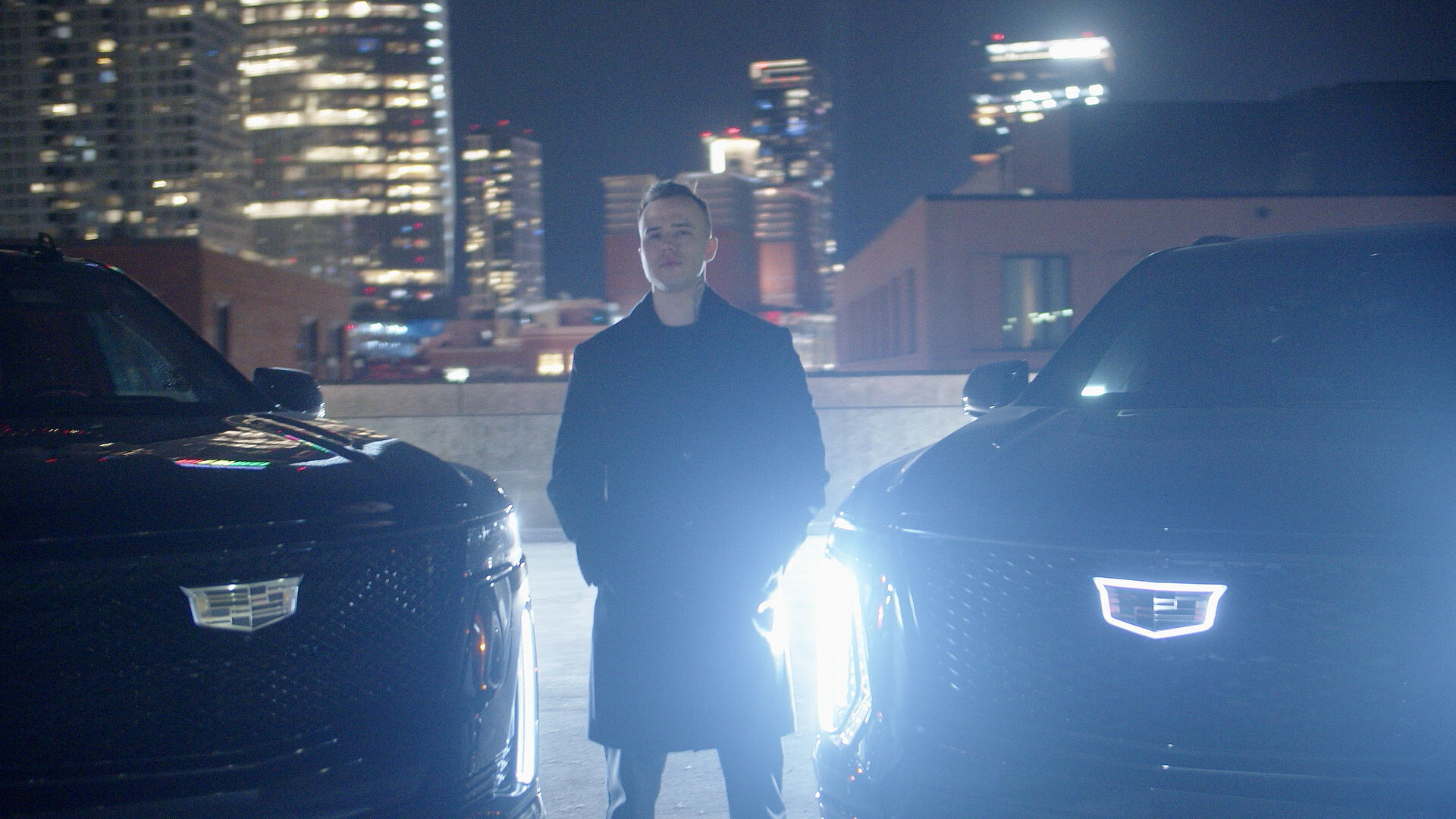 Black luxury SUV in Chicago at night