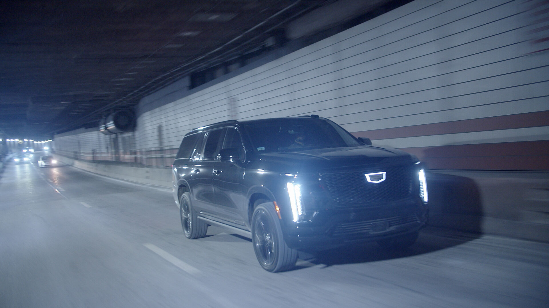 Black luxury SUV in Houston at night